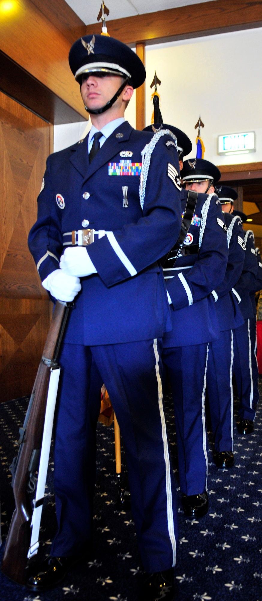 Ramstein Honor Guard members (from front) U.S. Air Force Staff Sgt. Shaun Pettis, Senior Airman Gabriel Rosa, Staff Sgt. Travis Henrie, Senior Airmen Sukhwi Yoo and Kristi Browning prepare to post the colors before the Prisoner of War/Missing in Action Luncheon Sept. 17, 2010, at the officers? spouses club here. (U.S. Air Force photo by Senior Airman Amanda Dick)