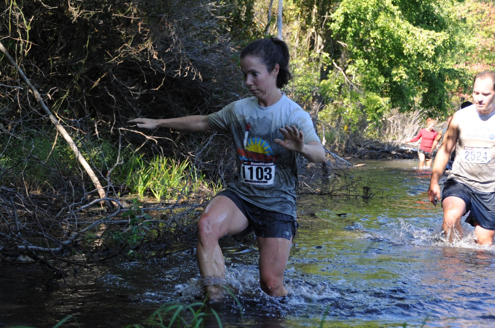 Participants carefully maneuvered through obstacles such as the 200-yard "Marsh Madness" trek through swampland. (U.S. Air Force photos/Staff Sgt. Danielle Johnson)
