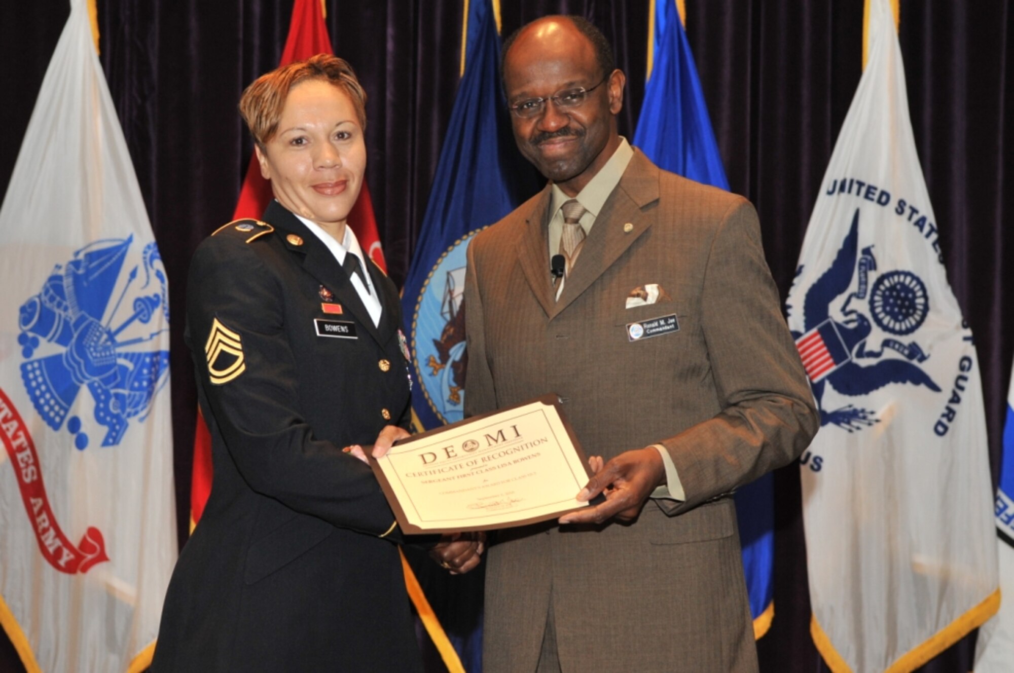 Mr. Ronald M. Joe, Commandant of the Defense Equal Opportunity Management Insititute, presents the Commandant's Award to Sgt. 1st Class Lisa Bowens.
The Commandant's Award is the most prestigious of the DEOMI Class Awards and recognizes the best overall achievement from among all students in the class. Sgt. 1st Class Bowens is an Equal Opportunity Advisor assigned to the United States
Army Intelligence and Security Command (INSCOM), Ft. Belvoir, Va.