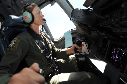 Capt. Jamie Turner prepares to engage a C-17 in aerial refueling with a KC-135 from the 134th Air Refueling Squadron out of McGee Tyson Tenn., during a route flying mission from Joint Base Charleston, S.C., Sept. 15, 2010. Captain Turner was selected as one of 1,800 Iroman World Championship competitors. She will test her physical and mental endurance against one of the biggest challenges the sports world has to offer. Captain Turner will swim 2.4-miles through ocean waves, bike 112-miles and run a 26.2-mile marathon through challenging lava-covered terrain. Captain Turner is a pilot with the 315th Airlift Wing. (US Air Force photo/James M. Bowman)