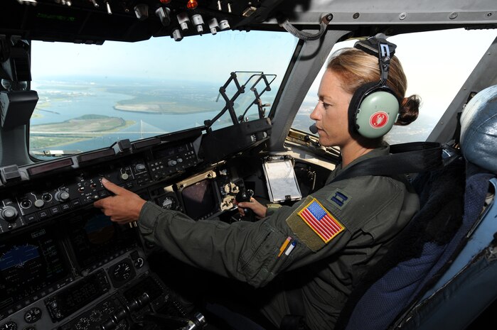 Capt. Jamie Turner flies a route training mission from Joint Base Charleston, S.C., Sept. 15, 2010. Captain Turner was selected as one of 1,800 Iroman World Championship competitors. She will test her physical and mental endurance against one of the biggest challenges the sports world has to offer. Captain Turner will swim 2.4-miles through ocean waves, bike 112-miles and run a 26.2-mile marathon through challenging lava-covered terrain. Captain Turner is a pilot with the 315th Airlift Wing. (US Air Force photo/James M. Bowman)