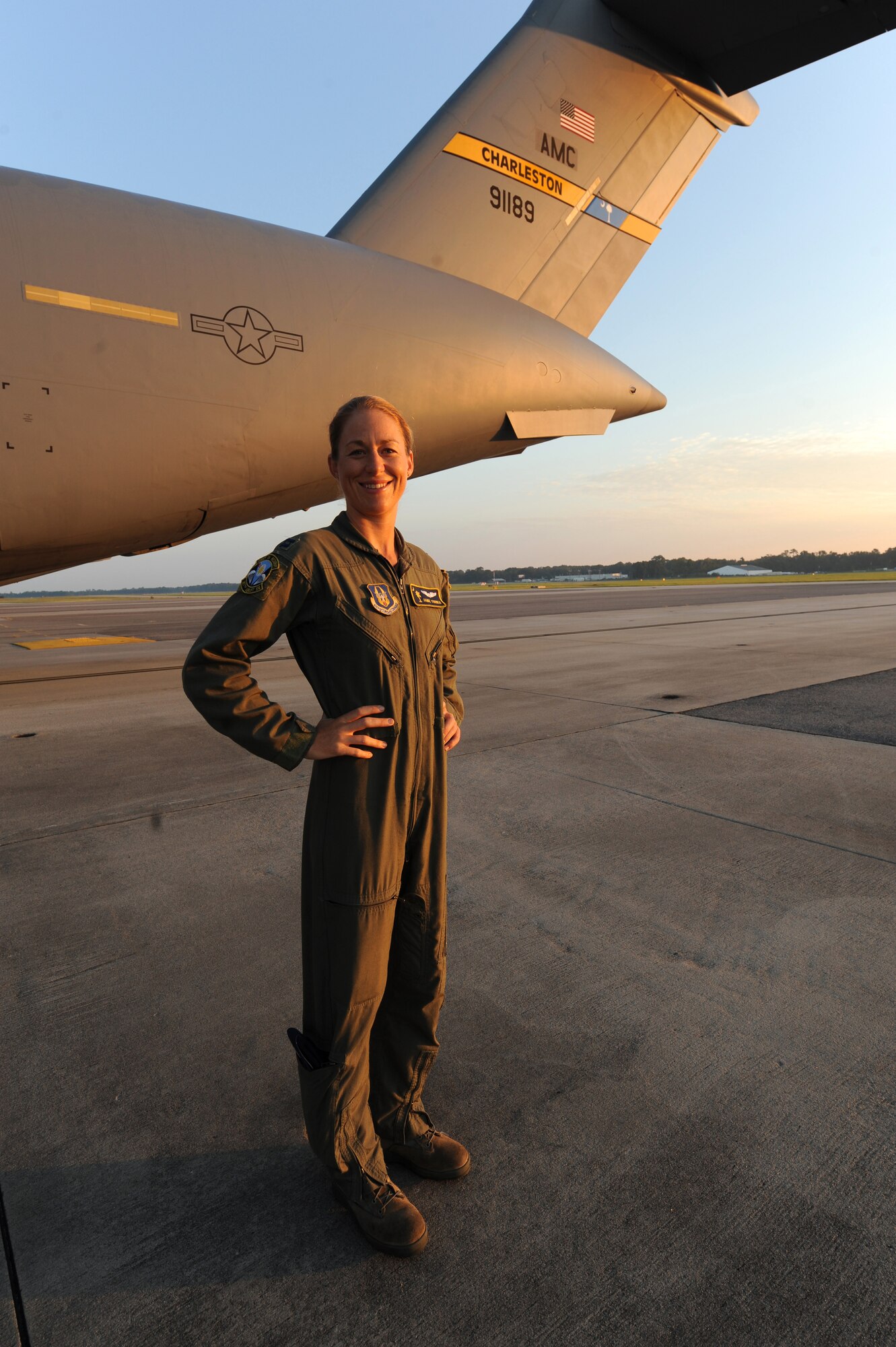 Capt. Jamie Turner stands in front of a  C-17 prior to a routine flying training mission from Joint Base Charleston, S.C., Sept. 15, 2010. Captain Turner was selected as one of 1,800 Iroman World Championship competitors. She will test her physical and mental endurance against one of the biggest challenges the sports world has to offer. Captain Turner will swim 2.4-miles through ocean waves, bike 112-miles and run a 26.2-mile marathon through challenging lava-covered terrain. Captain Turner is a pilot with the 315th Airlift Wing. (US Air Force photo/James M. Bowman)