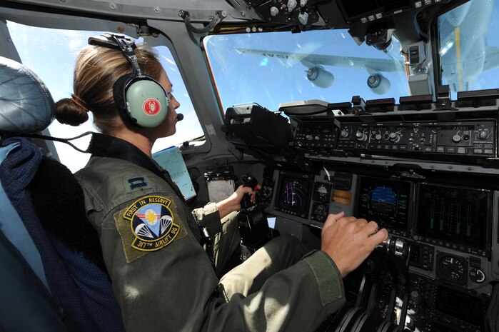 Capt. Jamie Turner prepares to engage a C-17 Globemaster III in aerial refueling with a KC-135 from the 134th Air Refueling Squadron out of McGee Tyson Tenn., during a route flying mission form Joint Base Charleston, S.C., Sept. 15, 2010. Captain Turner was selected as one of 1,800 Iroman World Championship competitors. She will test her physical and mental endurance against one of the biggest challenges the sports world has to offer. Captain Turner will swim 2.4-miles through ocean waves, bike 112-miles and run a 26.2-mile marathon through challenging lava-covered terrain. Captain Turner is a pilot with the 315th Airlift Wing. (US Air Force photo/James M. Bowman)