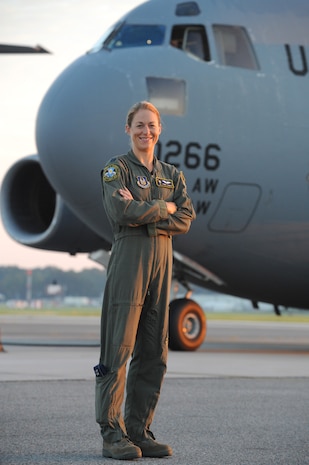 Capt. Jamie Turner stands in front of a  C-17 prior to a routine flying training mission from Joint Base Charleston, S.C., Sept. 15, 2010. Captain Turner was selected as one of 1,800 Iroman World Championship competitors. She will test her physical and mental endurance against one of the biggest challenges the sports world has to offer. Captain Turner will swim 2.4-miles through ocean waves, bike 112-miles and run a 26.2-mile marathon through challenging lava-covered terrain. Captain Turner is a pilot with the 315th Airlift Wing. (US Air Force photo/James M. Bowman)