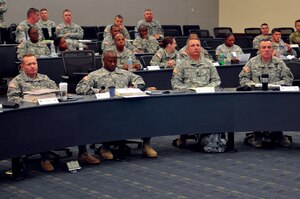 The 7th Sustainment Brigade command team and support operations officers await a briefing during the 7th Sust. Bde. Battle Command Seminar at Fort Leavenworth, Kan. Sept. 10. The seminar ran from Sept. 6 through 10 to prepare brigade staff for future battle command operations. (Photo by Staff Sgt. Alexander Burnett, 7th Sustainment 
Brigade Public Affairs)
