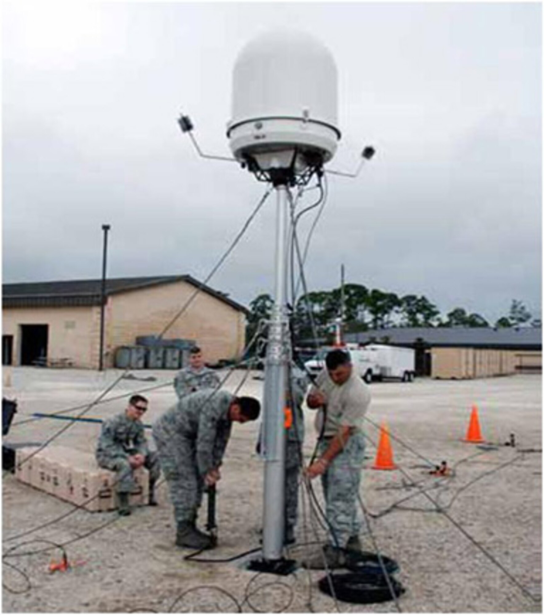 Airmen set up a portable Doppler radar system.  The Electronic Systems Center  is working to bring the improved capabilities the system offers to warfighters. (Courtesy photo) 
