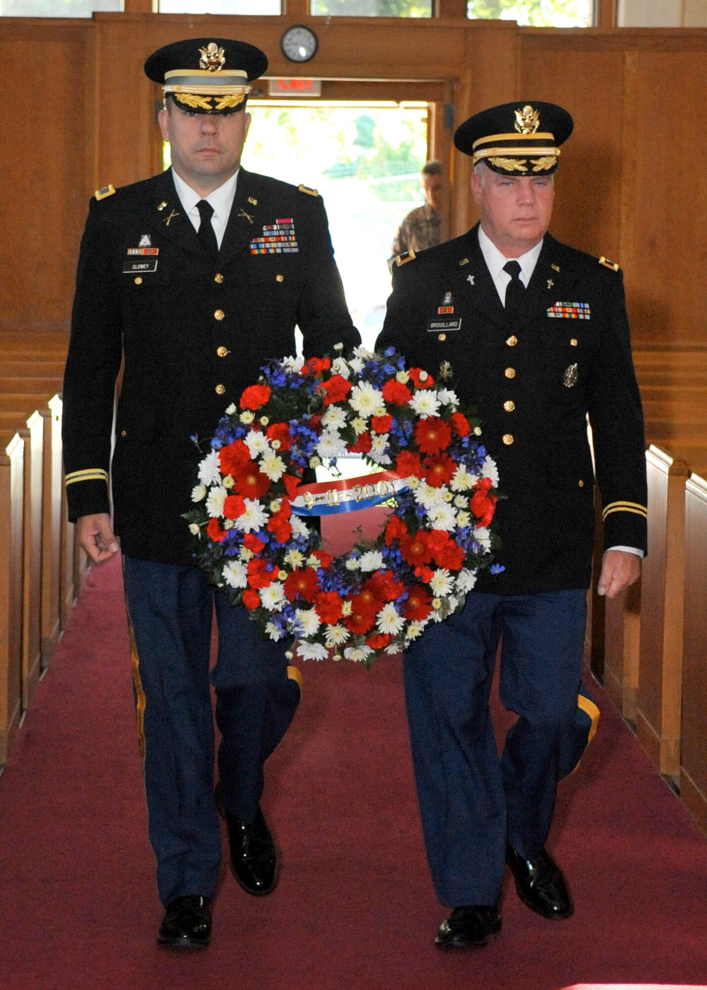 Col. Patrick Slowey, Army Support Activity-Dix commander, and Chaplain (Col.) Thomas Brouillard, ASA-Dix command chaplain, present a wreath in remembrance of Sept. 11, 2001 during the 9/11 Memorial Ceremony held at the Soldiers Chapel here Sept. 10. (U.S. Air Force photo/Wayne Russell)