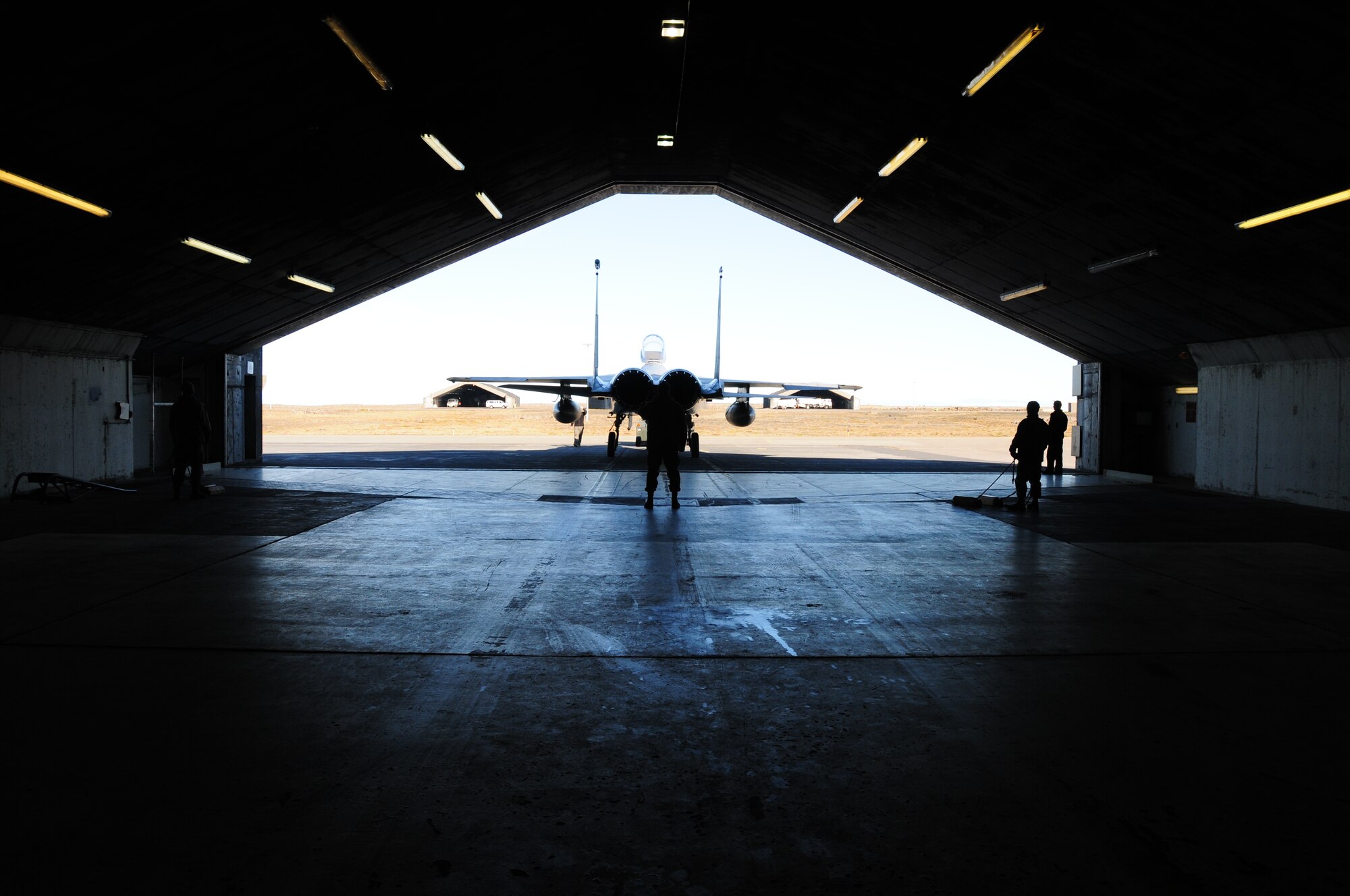 KEFLAVIK, Iceland – Airmen back an F-15 into a hangar Sept. 16, 2010. The 493rd Expeditionary Fighter Squadron has been maintaining control of the Icelandic Air Policing mission since Sept. 6, 2010, when the squadron achieved full operational capable status. (U.S. Air Force photo/Senior Airman Stephen Linch)