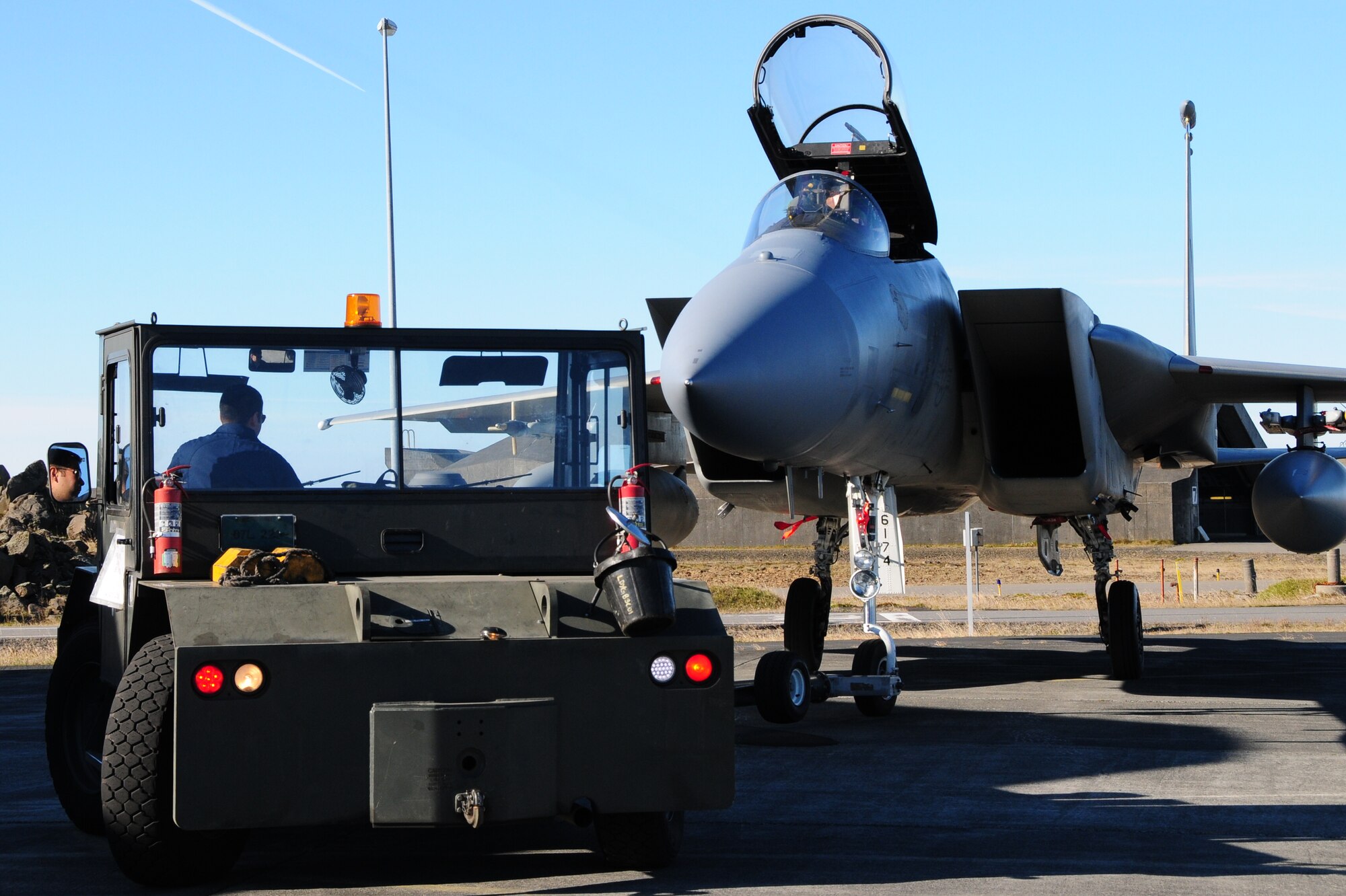 KEFLAVIK, Iceland – Staff Sgt. Brandon Mulford, 493rd Expeditionary Fighter Squadron, turns an F-15 around so he can put the aircraft in a hangar Sept. 16, 2010. Sergeant Mulford is deployed from the 748th Aircraft Maintenance Squadron at RAF Lakenheath, England. In addition to the Airmen from the 48th Fighter Wing at RAF Lakenheath, England, there are Airmen from as close as the 100th Air Refueling Wing at RAF Mildenhall, England, and as far away as the 56th Training Squadron at Luke Air Force Base, Ariz. (U.S. Air Force photo/Senior Airman Stephen Linch)