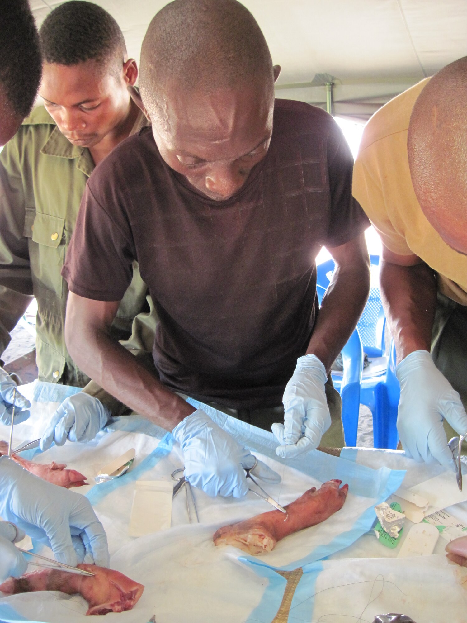 KISINGANDI, Democratic Republic of the Congo – Democratic Republic of the Congo soldiers receive hands-on training by a team from the 96th Medical Group at Eglin Air Force Base, Fla. during a 14-week course on the medical skills needed to support their Light Infantry Battalion in a wartime situation on Sept 10. Training also included conducting physical exams, applying bandages, treating for shock, transporting wounded, basic defense, weapons qualification and land navigation techniques (U.S. Air Force photo)