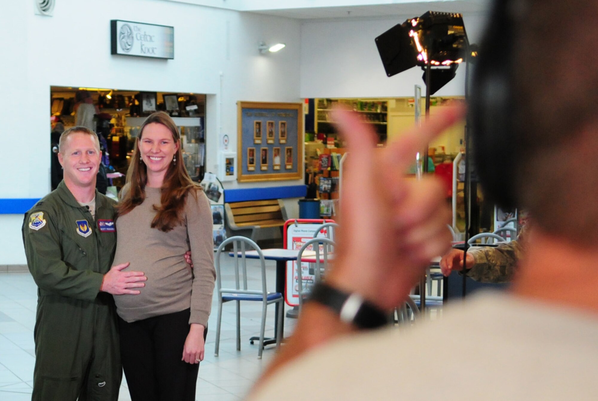 RAF MILDENHALL, England -- Capt. Scott Frohardt, 351st Air Refueling Squadron, and his wife Andrea prepare to record their Hometown Holiday Greeting which will be aired in their families’ hometown in Denver, Colo., during the holiday season. The video team: Scott Williams (pictured), broadcast producer; Erich Schwab, broadcast producer; and Tech. Sgt. Sean Worrell, photographer, are all part of the Joint Hometown News team based out of San Antonio, Texas.  (U.S. Air Force photo/Karen Abeyasekere)