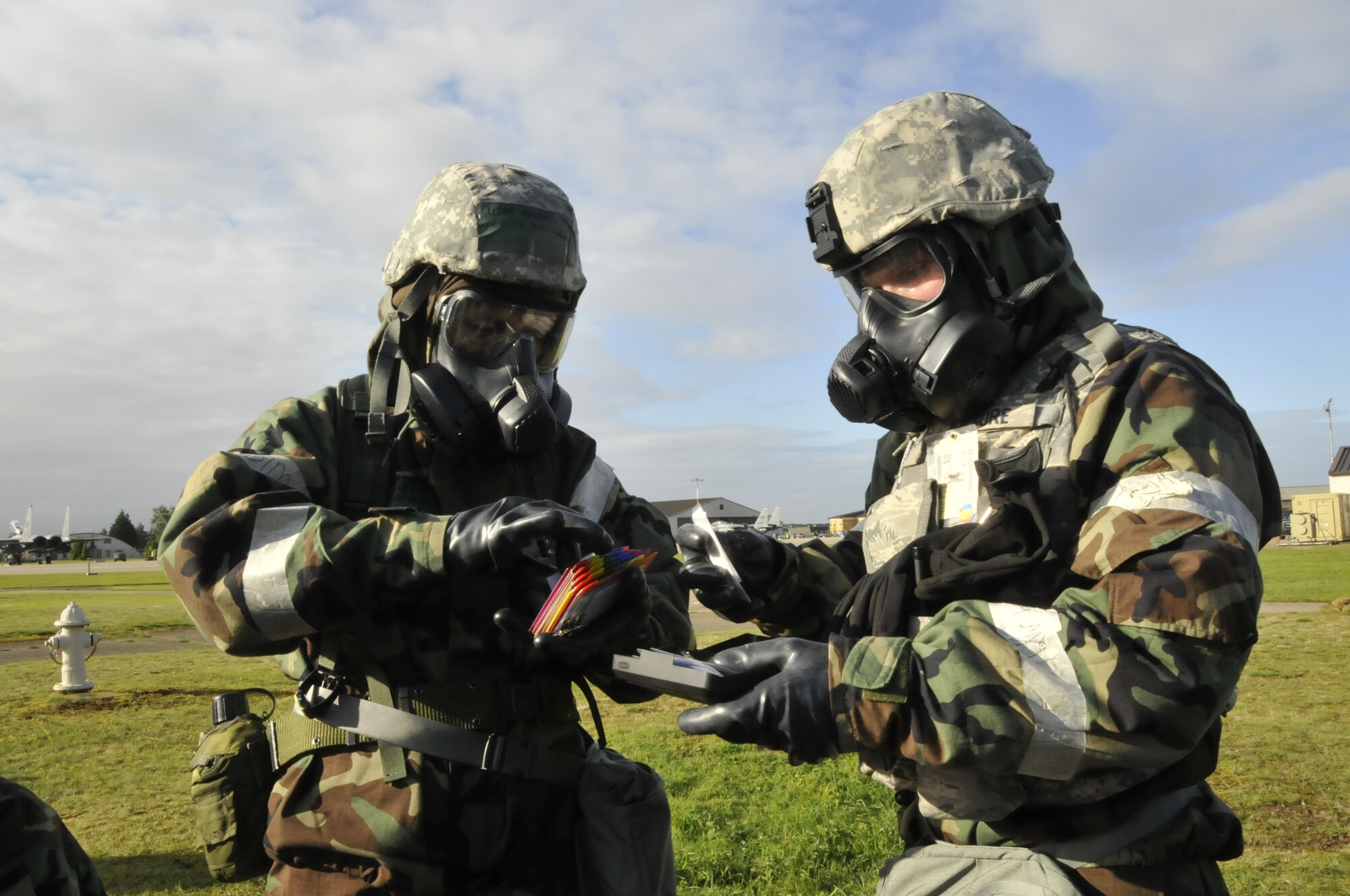 Col. Cassie Barlow, 48th Mission Support Group commander, (left) verifies accountability with Airman 1st Class Brandon Kilgore, 48th Security Forces squadron guardsman during an operational readiness exercise on RAF Lakenheath, England Sept. 16. (U.S. Air Force photo/Air 1st Class Eboni Knox)
