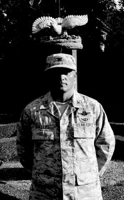 RAF MILDENHALL, England -- Col. Michael Winters, 100th Air Refueling Wing vice commander, stands at parade rest in front of the Prisoner of War/Missing in Action memorial here during the 24-Hour Vigil Sept. 16. The base hosts the vigil as part of the annual POW/MIA Remembrance Week. (U.S. Air Force photo/Senior Airman Ethan Morgan)