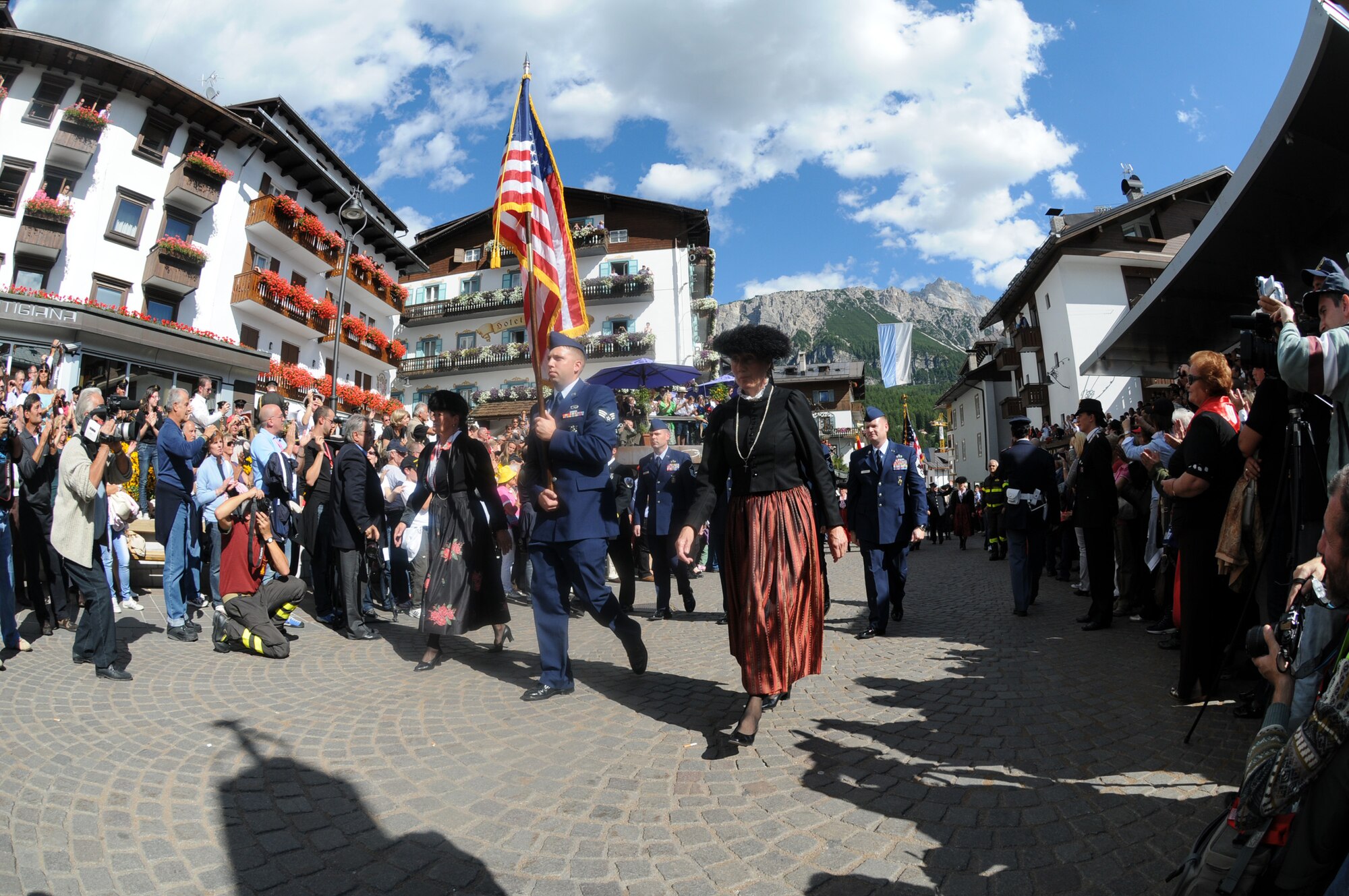 Firefighters with the 31st Civil Engineer Squadron Fire Protection Flight march during the first national gathering of firefighters parade Sept. 11 in Cortina d’Ampezzo, Italy. (U.S. Air Force photo/Staff Sgt. Julius Delos Reyes)