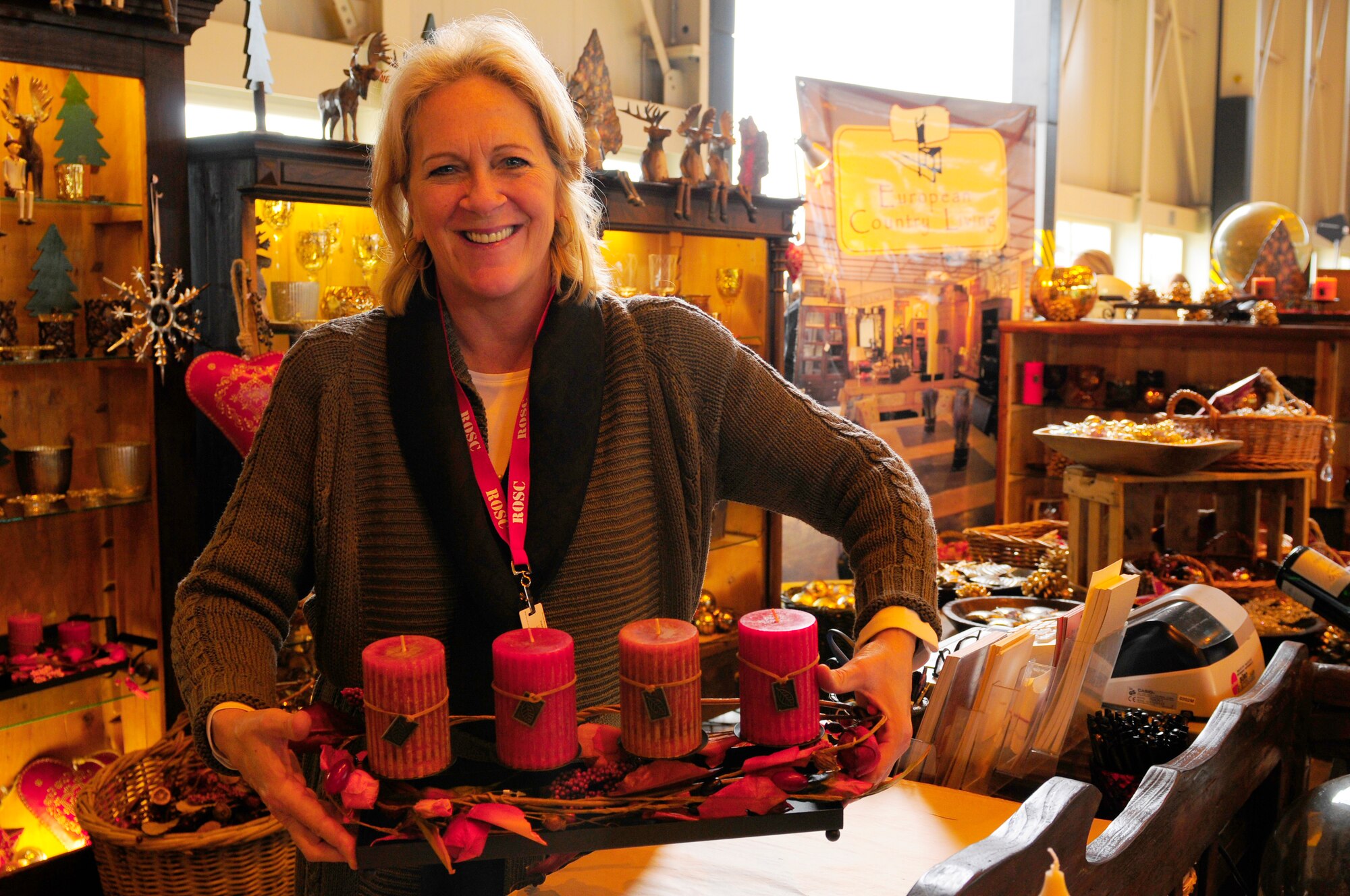 Holly Ginas, European Country Living home store, shows a fall display that she put together at the Ramstein Welfare Bazaar, Ramstein Air Base, Germany, Sept. 16, 2010. For more than four decades, the Kaiserslautern Military Community has benefited from the Ramstein Welfare Bazaar. This annual event dates back to 1965 and has grown into one of the largest military bazaars in Europe. (U.S. Air Force photo by Airman Kendra Alba)