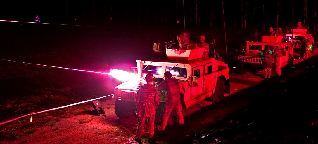 Three teams conduct a night live fire during the team weapons skills test on the final night during the thrid day of the 14th Annual Warfighter Challenge on Fort Leonard Wood, Mo., Sept. 15, 2010.