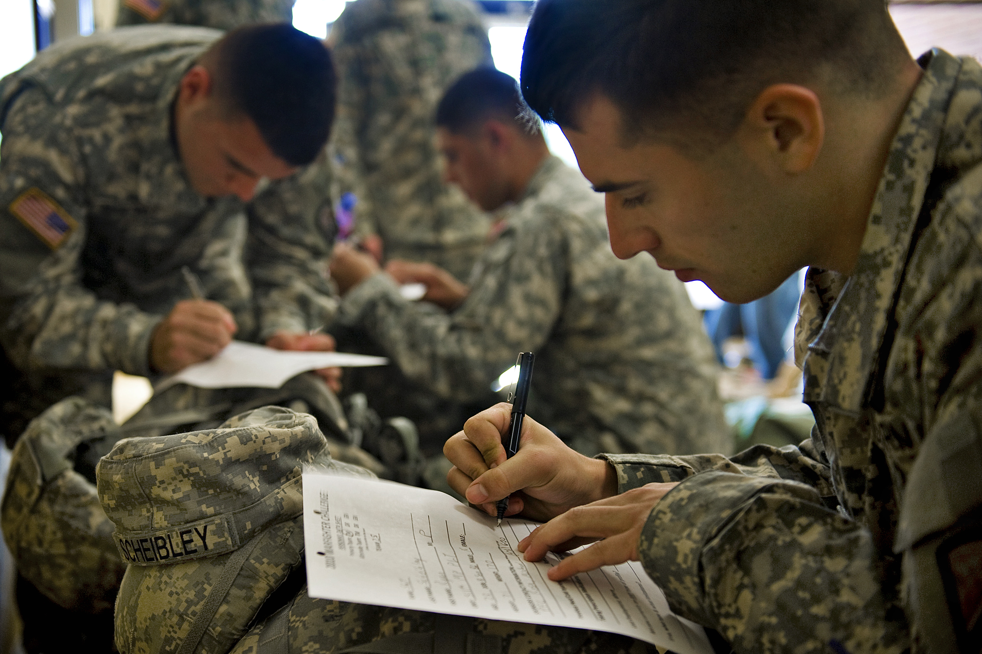 U S Army Soldiers Fill Out Mandatory Paperwork During Their Day One In Processing Of The 14th