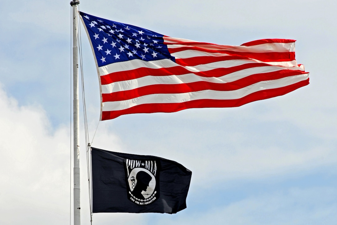 The Stars and Stripes are joined on the Pentagon flag pole by the POW/MIA flag in observance of National POW/MIA Recognition Day, Sept. 17, 2010.