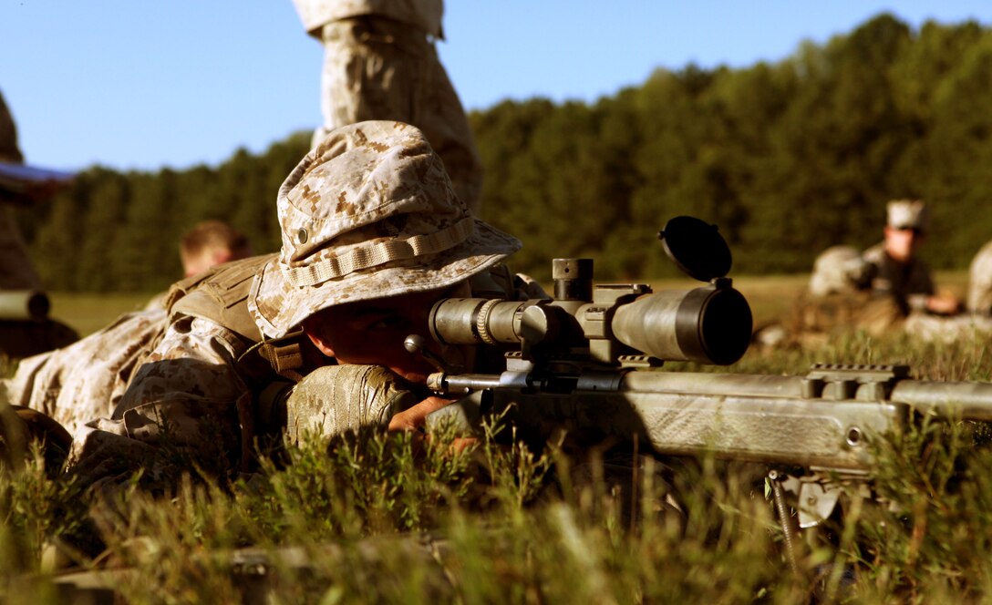 Lance Cpl Matthew Gearhart, a scout sniper with 3rd Battalion, 2nd Marine Regiment, Weapons Co., aims in on his target during a training exercise aboard Ft. Pickett Va., Sept. 19. Gearhart and the rest of the battalion is preparing to deploy to Afghanistan in support of Operation Enduring Freedom.