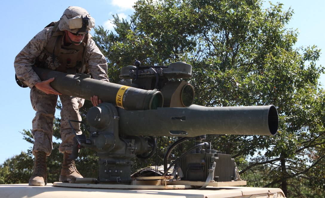 Pfc. Tanner M. Tramel, an anti-tank guided missile man loads a TOW missile into the M41A1 Saber System before moving to the firing line.  Tramel was one of 12 Marines who had the opportunity to fire a TOW missile for the first time, here, recently.
