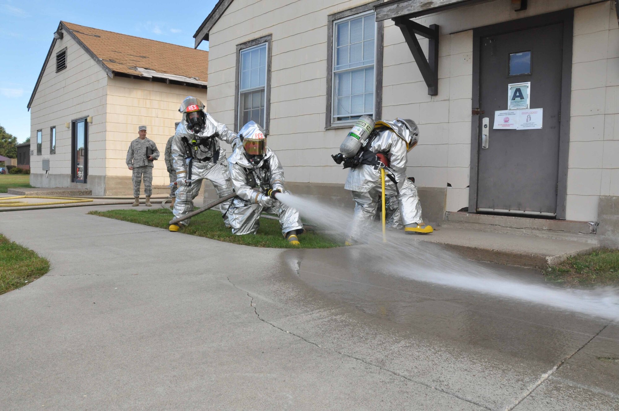 934th Civil Engineer Squadron firefighters test their skills during a building evacuation exercise Sept. 18. (Air Force Photos/Tech. Sgt. Bob Sommer)