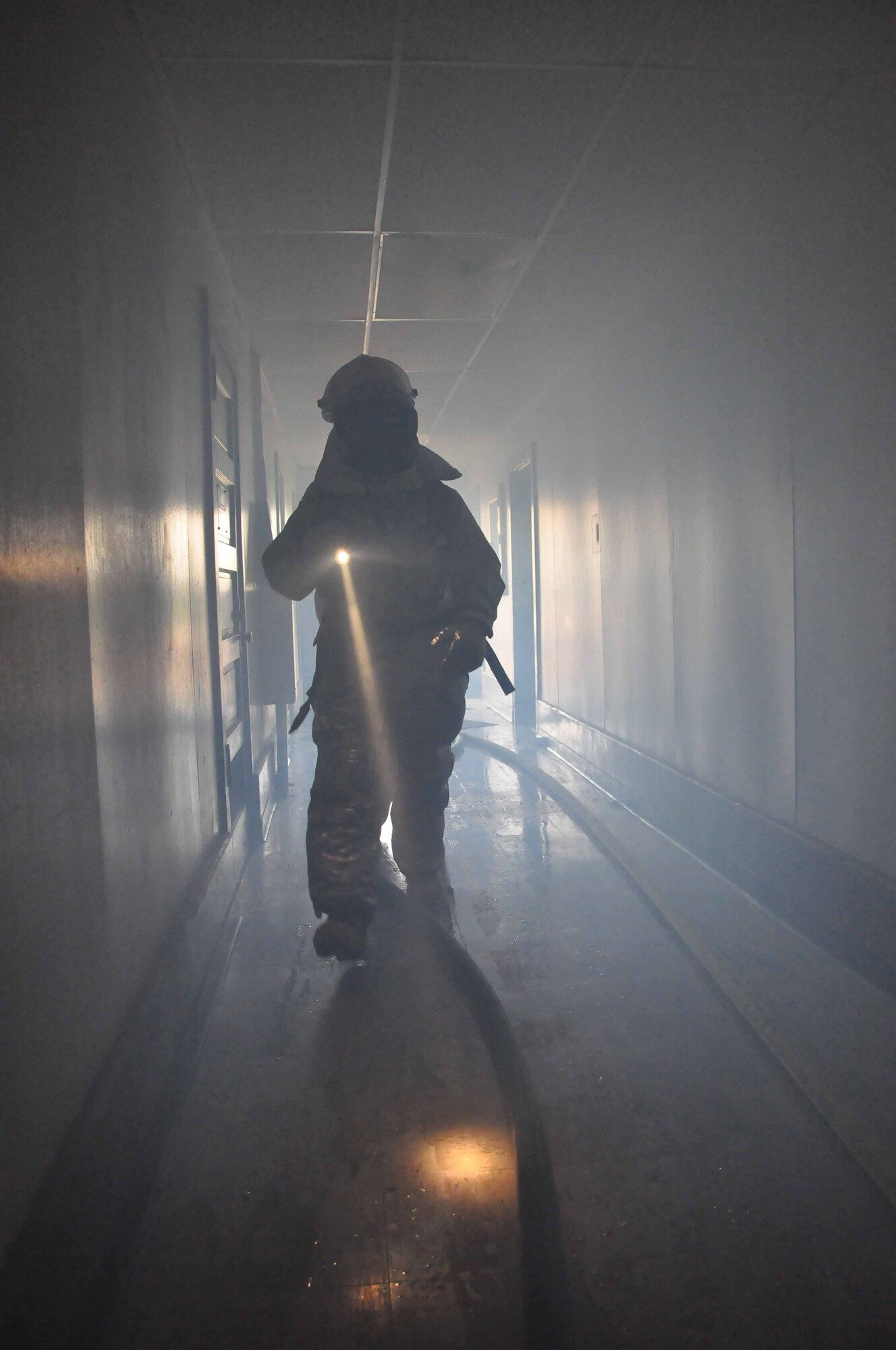 934th Civil Engineer Squadron firefighters test their skills during a building evacuation exercise Sept. 18. (Air Force Photos/Tech. Sgt. Bob Sommer)