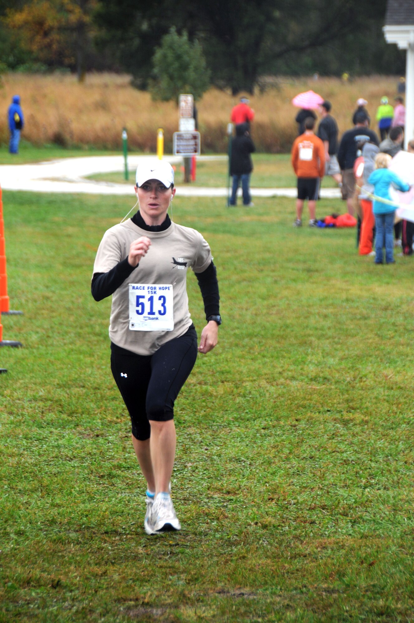 Second Lieutenant Jennifer Carlson, 185th Air Refueling Wing (ARW), Equal Opportunity, Sioux City, Iowa, finishes the 15K portion of the June E. Nylan Run for Hope held at the Adams Nature Preserve in McCook Lake, SD. The 185 ARW is the honorary ambassador for this year's event.