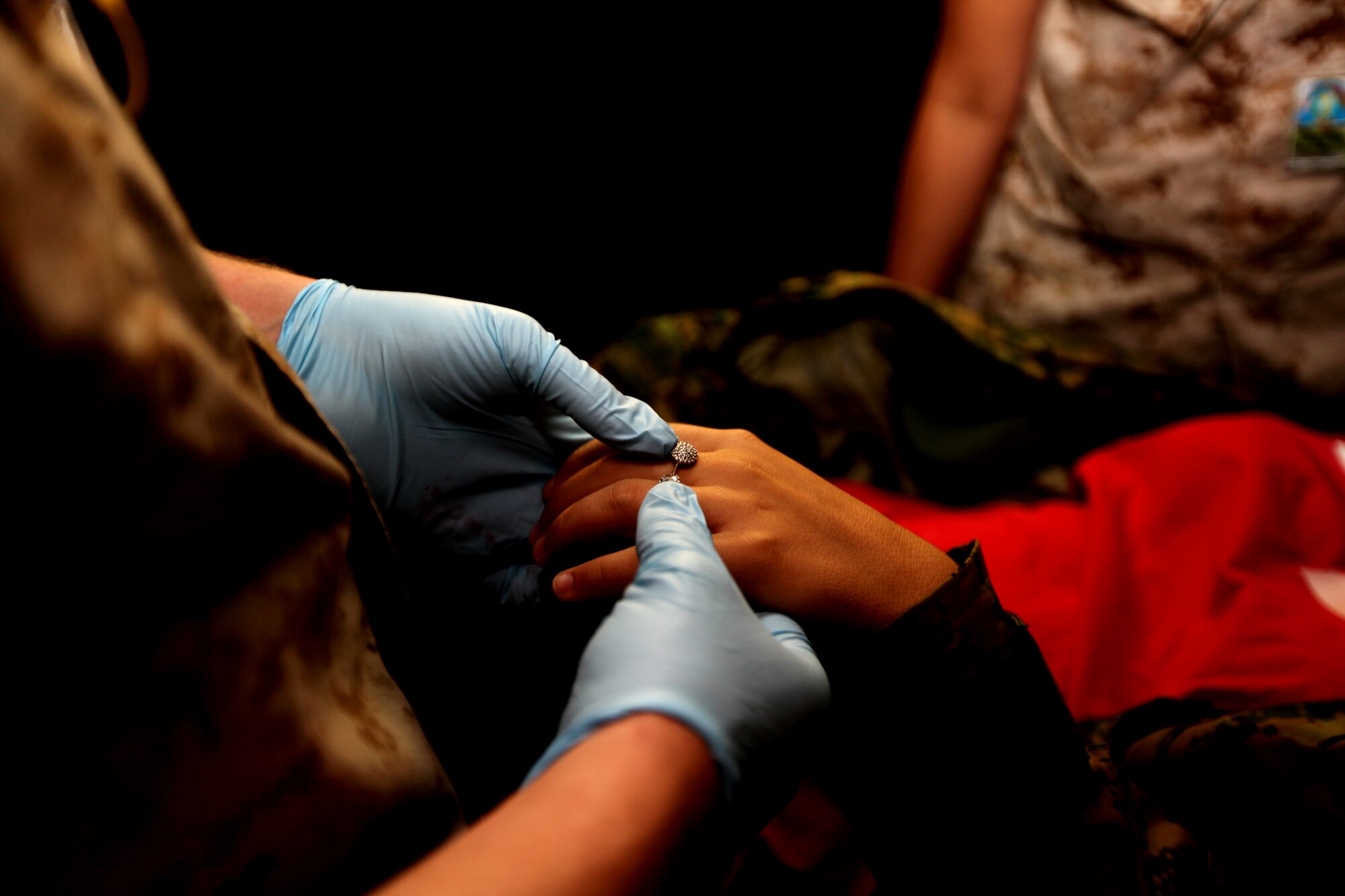 Lance Cpl. Kyle Fikbeiner, a Personnel Retrieval and Processing specialist with Detachment PRP, Smyrna, Ga., examines a faux corpse’s ring Sept. 15 inside the mock PRP collection point set up during the 2010 Medical Training Exercise in Central and Eastern Europe at Danilovgrad Army Base, Montenegro. The exercise challenges approximately 250 military medical personnel from the U.S. and nine central and eastern European nations to respond to a series of simulated disasters by collecting and treating role-player casualties. For more information, go to www.usafe.af.mil/medceur.asp and www.odbrana.gov.me. (U.S. Marine Corps photo/Lance Cpl. Jad Sleiman)