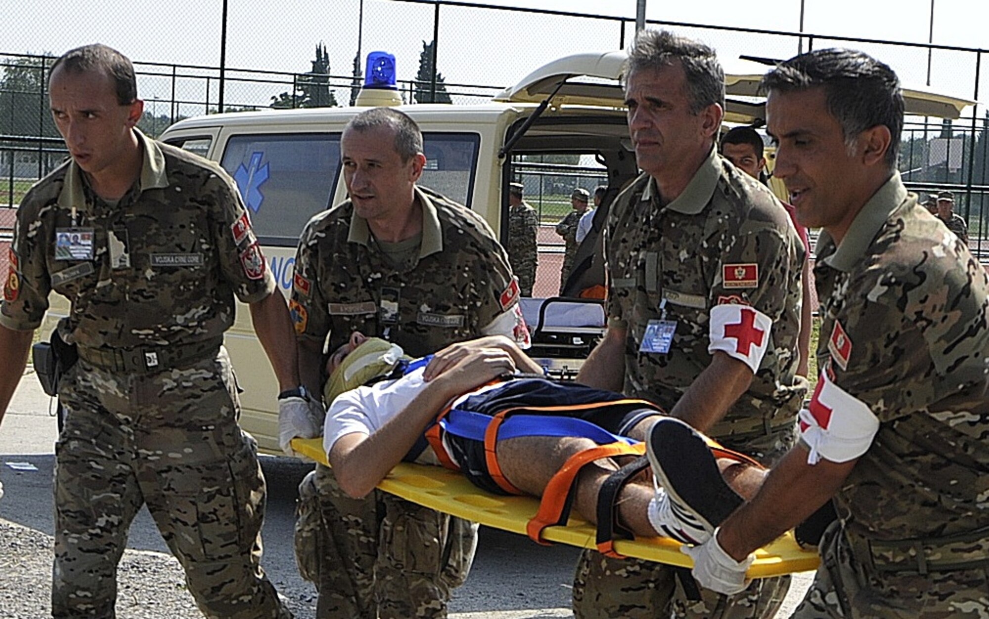 Montenegrin armed forces medics carry an acting victim on a stretcher to a medical treatment tent during a medical exercise as part of MEDCEUR 10, a medical training exercise in central and eastern Europe, at Danilovgrad Army Base, Montenegro, Sept. 17. Over 100 government ministers, flag officers and other distinguished visitors witnessed this exercise along with four other scenarios in which approximately than 250 servicemembers from ten nations were participating in to receive realistic training to be more prepared for real world situations. For more information, go to www.usafe.af.mil/medceur.asp and www.odbrana.gov.me. (U.S. Air Force photo/Airman 1st Class Tiffany M. Deuel)