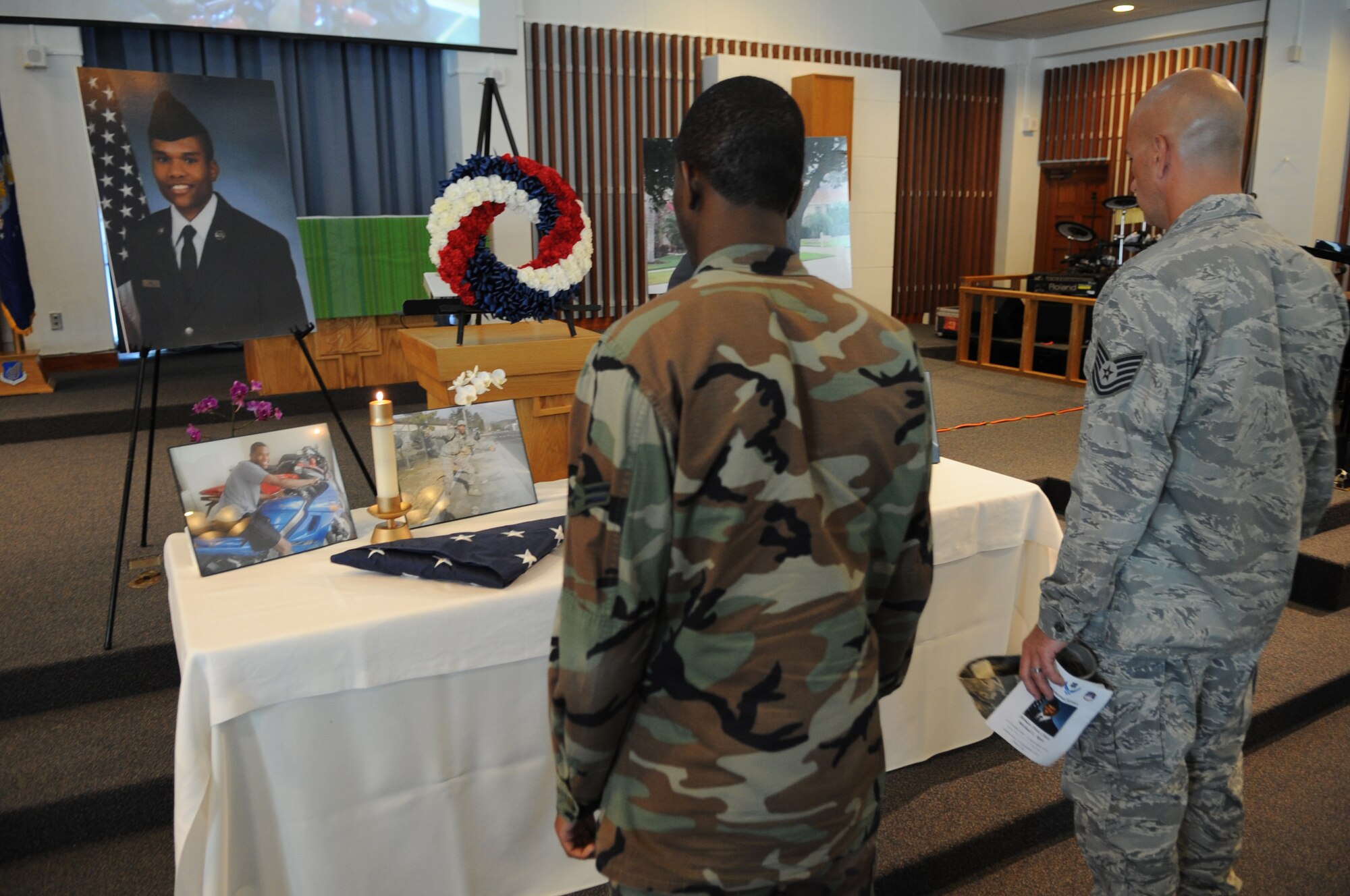 KADENA AIR BASE, Japan -- Enlisted members of the 353rd Special Operations Group prepare to deliver flags flown on MC-130s for the family of Airman 1st Class Michael Reio to officers during a memorial service here Sept. 15. Airman Reio, a 20-year-old Knowledge Operations Manager assigned to the 353rd SOG staff, died from injuries sustained in a single-vehicle accident here Sept. 9. (U.S. Air Force photo by Staff Sgt. Christopher Hummel)