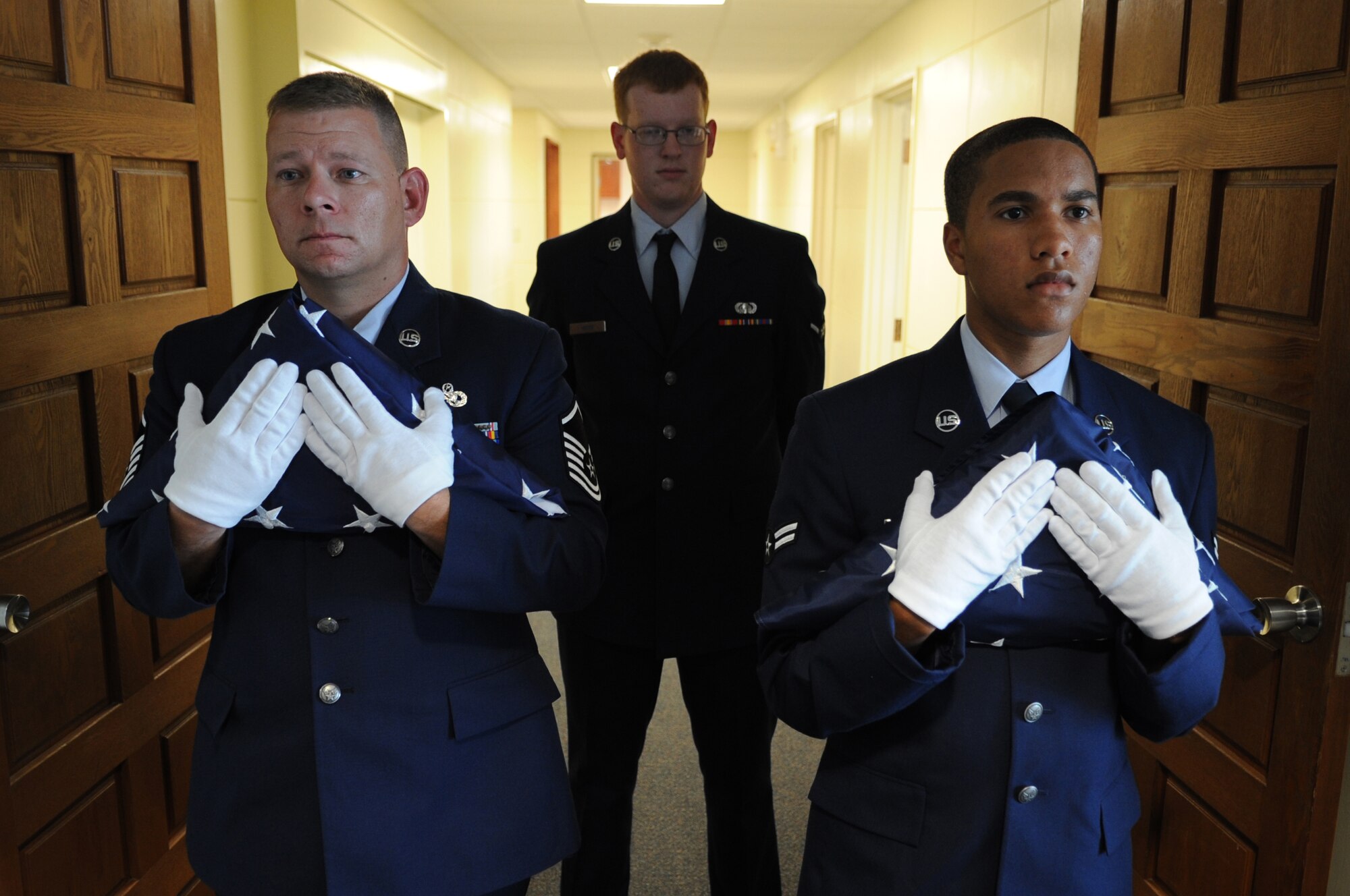KADENA AIR BASE, Japan -- Enlisted members of the 353rd Special Operations Group prepare to deliver flags flown on MC-130s for the family of Airman 1st Class Michael Reio to officers during a memorial service here Sept. 15. Airman Reio, a 20-year-old Knowledge Operations Manager assigned to the 353rd SOG staff, died from injuries sustained in a single-vehicle accident here Sept. 9. (U.S. Air Force photo by Staff Sgt. Christopher Hummel)