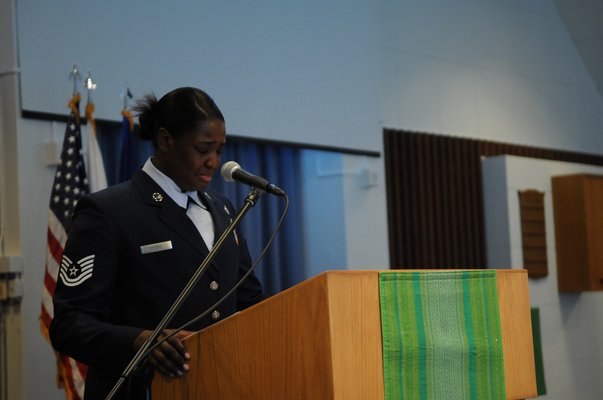 KADENA AIR BASE, Japan -- Tech. Sgt. Danielle Myers fights back tears as she shares stories of her time working with Airman 1st Class Michael Reio at the end of his memorial ceremony here Sept. 15. Airman Reio, a 20-year-old Knowledge Operations Manager assigned to the 353rd SOG staff, died from injuries sustained in a single-vehicle accident here Sept. 9. (U.S. Air Force photo by Airman 1st Class Jarvie Wallace)