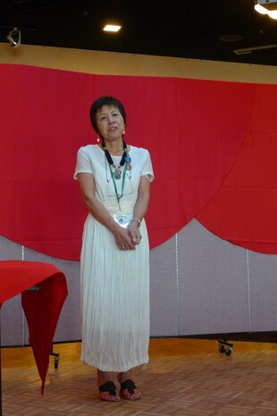 Taeko Yoshioka, air operations technical information specialist, is honored in an awards ceremony Sept. 19 for the 30 years and 8 months of service she has done for the station. Yoshioka was revered for the way she was able to communicate with both the Japanese and Americans.