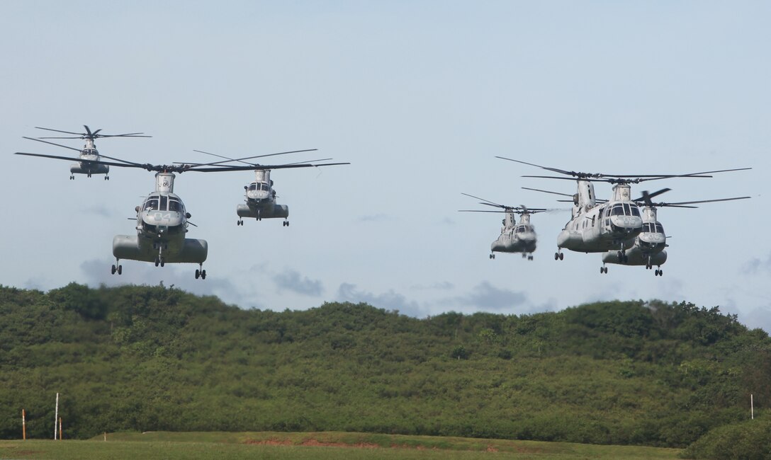 Six CH-46E Sea Knight helicopters with Marine Medium Helicopter Squadron 262 (Reinforced), known as the Flying Tigers, approach a landing site near Apra Harbor on the island of Guam, Sept. 19.   The helicopters flew from the USS Essex (LHD 2) transporting Marines of the 31st Marine Expeditionary Unit to perform a simulated airfeild seizure in support of the MEU's Certification Exercise.  The 31st MEU is holding CERTEX in Guam in conjunction with the Valiant Shield exercise already underway.