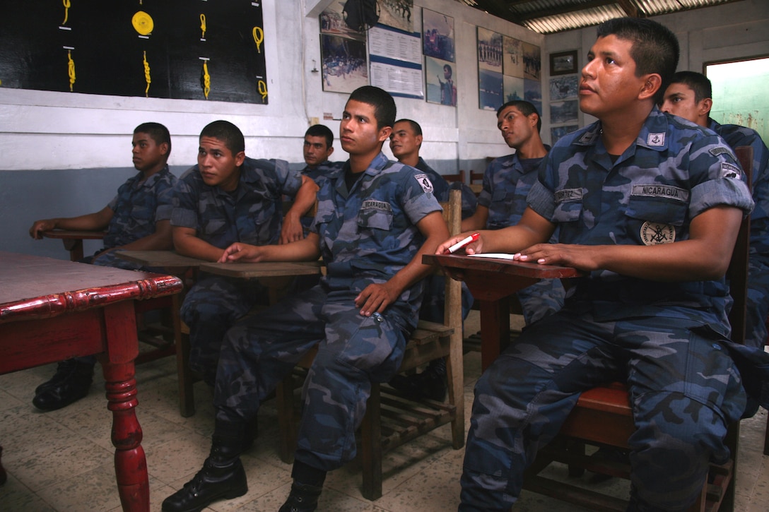 A student body consisting of one junior Nicaraguan lieutenant, a Nicaraguan navy petty officer and six soon-to-be Nicaraguan Marine Corps corporals listen attentively as Marines give them a class on leadership principles at Naval Base El Bluff, near Bluefields, Nicaragua, Sept. 19. Seven Marine non-commissioned officers and one staff NCO participated in a subject-matter expert exchange to give a leadership fundamentals course to eight members of the Nicaraguan navy and Marine Corps.