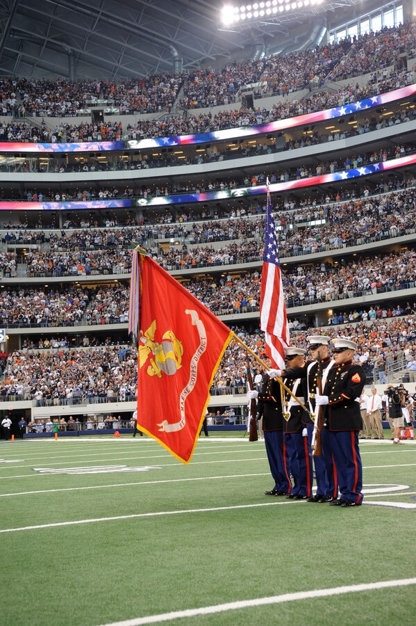 Marines with 8th Marine Corps District Color Guard present colors during the opening ceremonies at Cowboys Stadium, Arlington, Texas, September 20, 2010. The 8th Marine Corps District Headquarters is in Fort Worth, Texas, and is the higher command of eight recruiting stations spread throughout 10 states. The Color Guard participates in different events in the Dallas-Fort Worth metroplex to support local recruiters and community events.