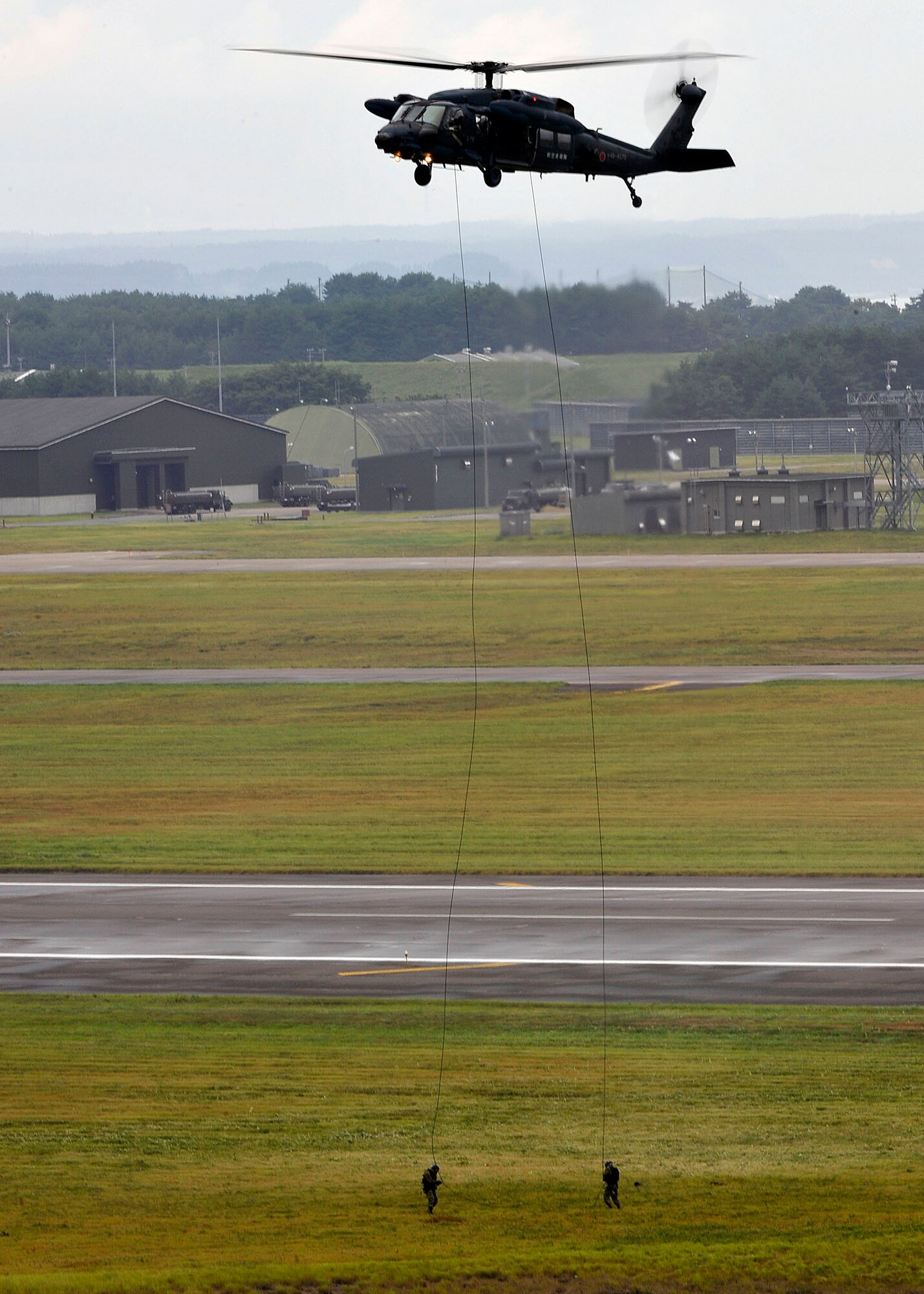 A Japanese UH-60 helicopter demonstrates its rescue capabilities during Misawa Air Festival 2010 Sept. 19, at Misawa Air Base, Japan. (U.S. Air Force photo by Staff Sgt. Chad Strohmeyer/Released)
