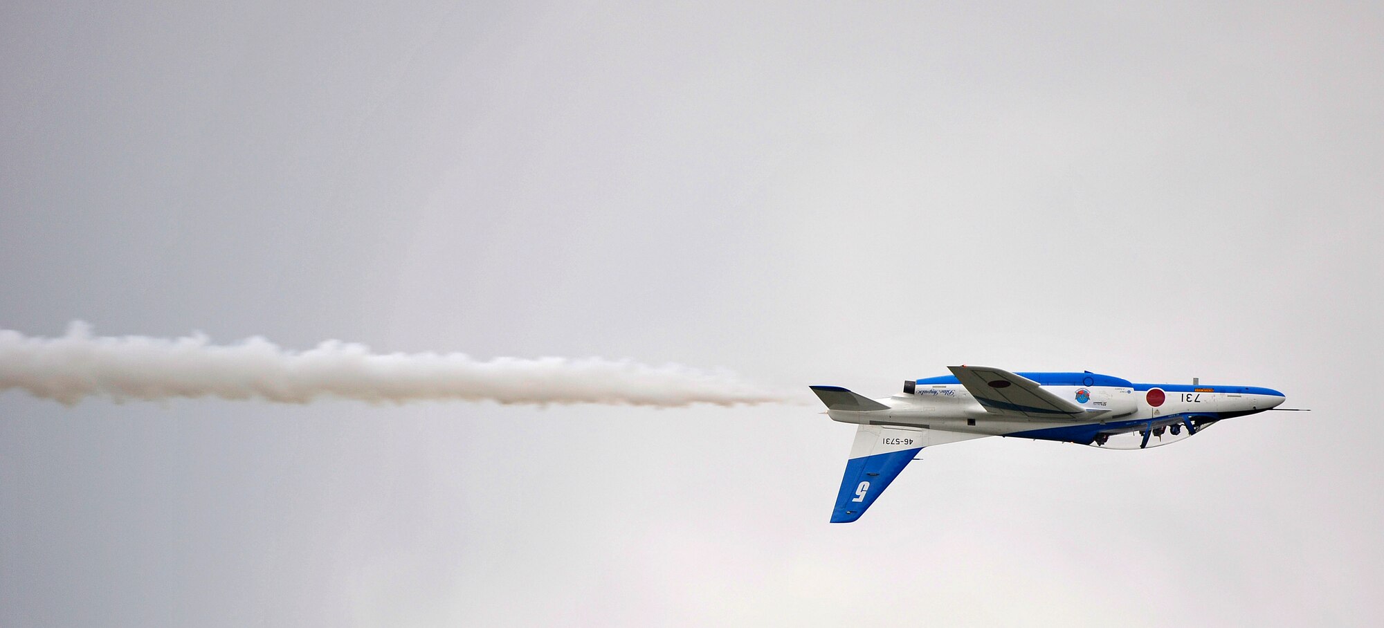 A member of the Japanese demonstration team Blue Impulse performs an aerial demonstration during Misawa Air Festival 2010 Sept. 19, at Misawa Air Base, Japan. (U.S. Air Force photo by Staff Sgt. Chad Strohmeyer/Released)