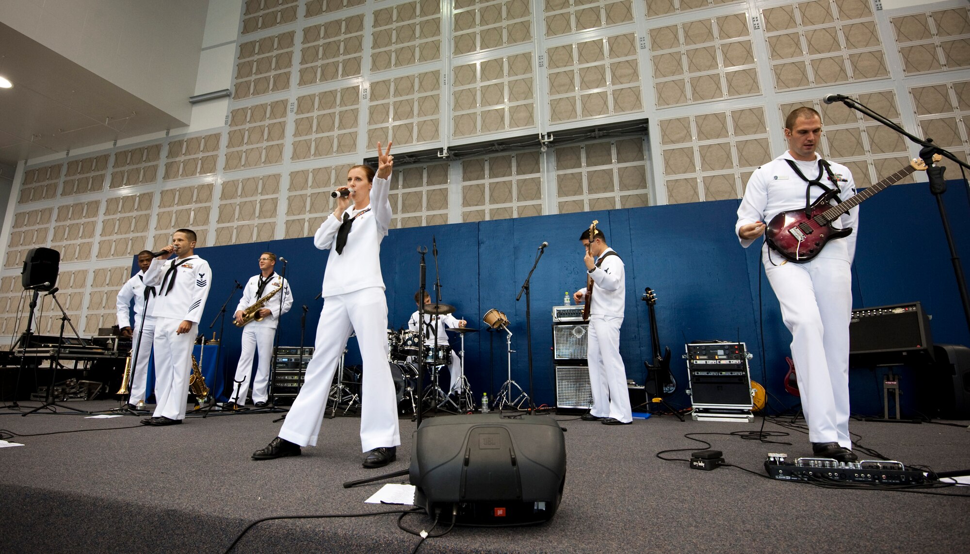 The U.S. Navy 7th Fleet Band "Orient Express" finishes a song during a feature performance in Hangar 963 during Misawa Air Festival 2010 at Misawa Air Base, Japan, Sept. 19, 2010. The band visited Misawa from Yokosuka, Japan. (U.S. Air Force photo by Staff Sgt. Samuel Morse/Released)
