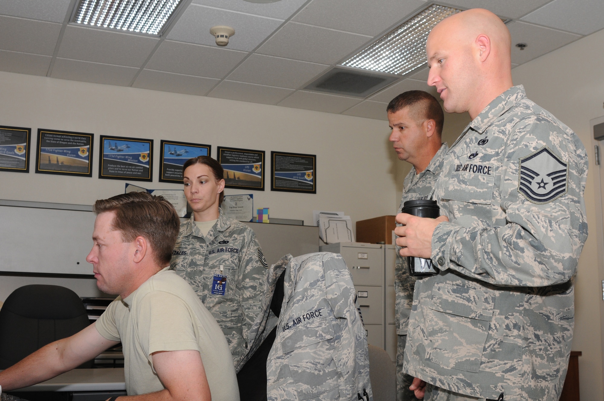 Master Sergeant Mike Loomis, Master Sergeant Jason Witts and Senior Master Sergeant Joe Oyler, 173rd Fighter Wing Traffic Management Flight, are inspected by a member of the Unit Compliance Inspection team at Kingsley Field, Ore., September 18, 2010.  Kingsley Field has been under the microscope by the UCI team this week to ensure the base is performing up to Air Force standards.  (U.S. Air Force photo by Senior Airman Bryan Nealy.) Released