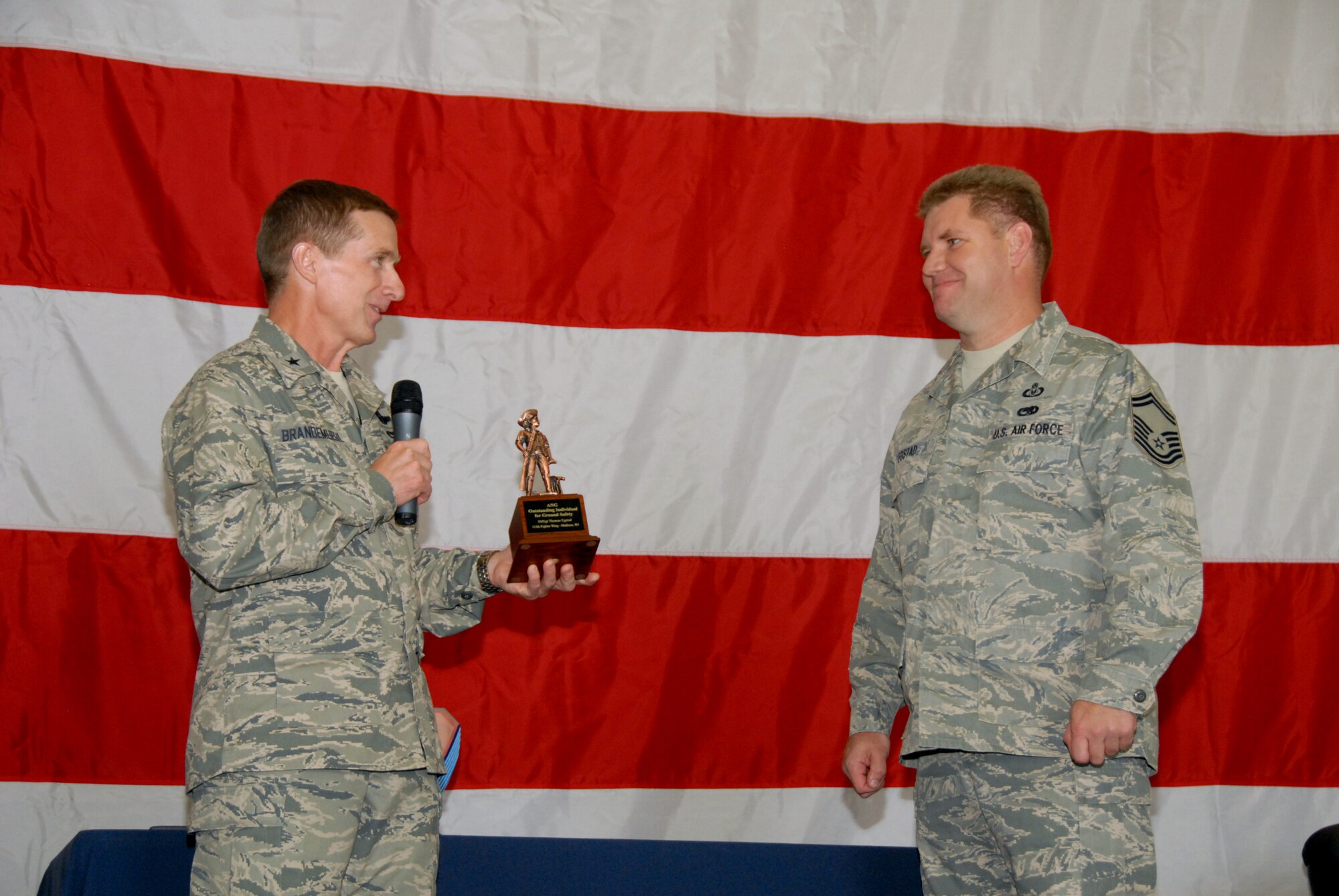 Brigadier General Joseph Brandemuehl, 115th Fighter Wing commander, presents the Air National Guard Safety Professional of the year to Sen. Master Sgt. Thomas Egstad of the 115th safety office. (U.S. Air Force photo by Tech. Sgt. Ashley Bell)  