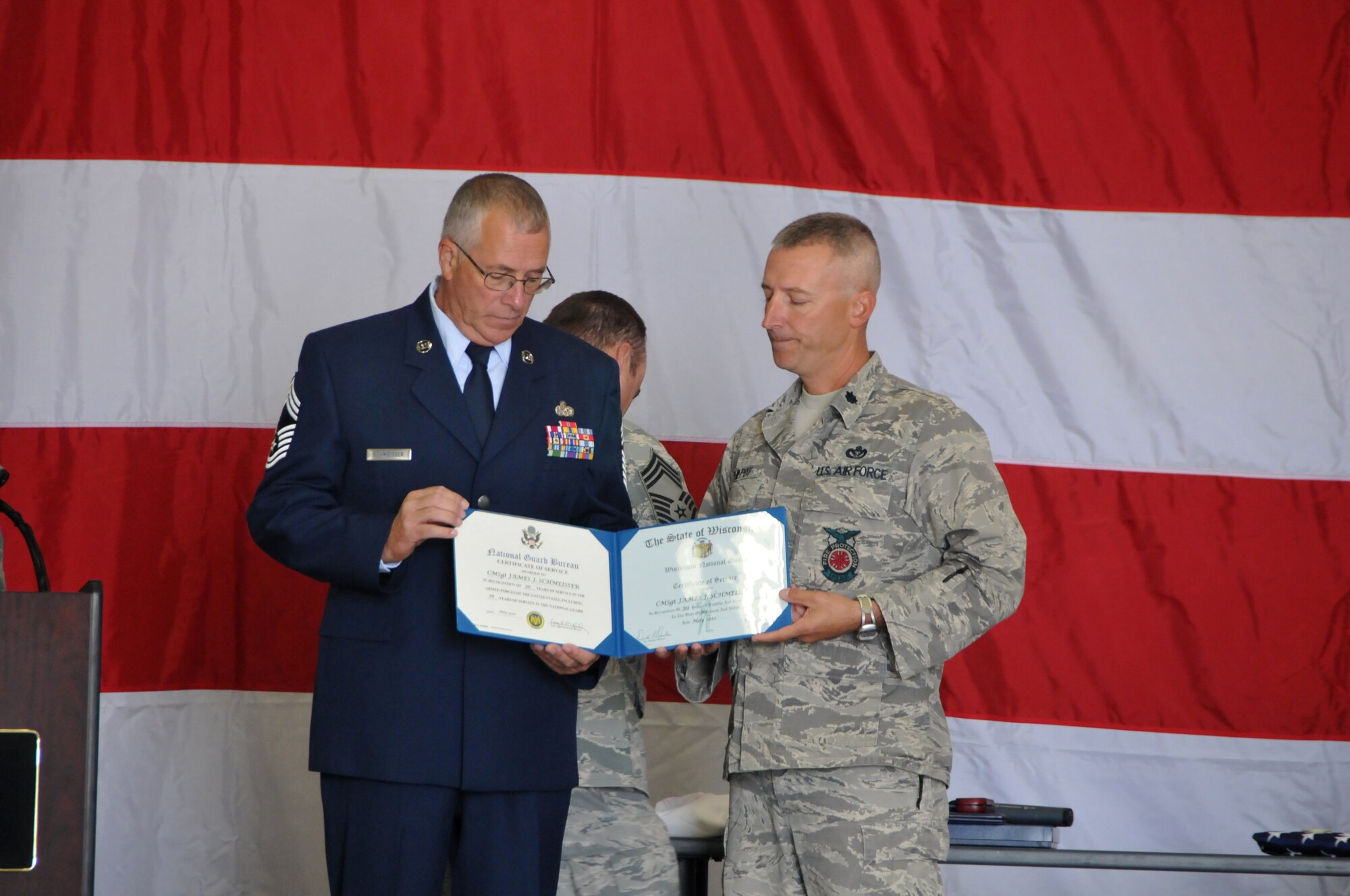 The 115th Fighter Wing held a retirement ceremony here for Chief Master Sgt. James Schmeisser, Sept. 18. During nearly 40 years of military service in the Wisconsin Air National Guard, Chief Schmeisser deployed over 15 times with the 115th Civil Engineering Squadron to locations all over the world. In his final year with the 115th FW, Chief Schmeisser served as the interim command chief for nine months. (U.S. Air Force photo by Tech. Sgt. Ashley Bell)
