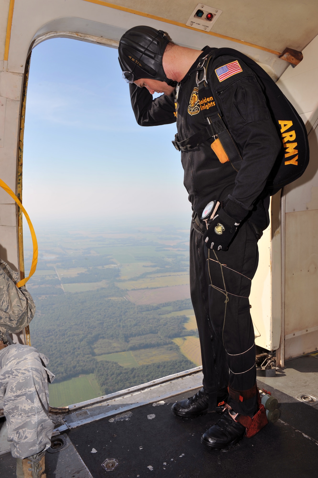 WHITEMAN AFB, MO - Staff Sgt. Aaron Figel, U.S. Army Golden Knights Demonstration Team parachutist, awaits the signal to jump for the Wings Over Whiteman Air Show, Sept. 18. Sergeant Figel is an Airborne Ranger, serving his second season as a demonstration parachutist with the gold demonstration team.  (U.S. Air Force photo/ Tech. Sgt. Charles Larkin Sr)