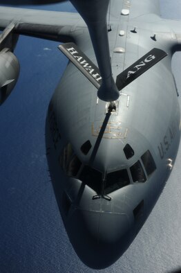 OVER THE PACIFIC -- A C-17 Globemaster III from the 15th Wing, Joint Base Pearl Harbor Hickam, takes on fuel from a Hawaii Air National Guard 204th Air Refueling Squadron KC-135 Stratotanker during a mission to Andersen Air Base, Guam. The 15th Wing and the Hawaii National Guard?s 154th Wing operate both the C-17 and the KC-135 in a Total Force Integration partnership. They also operate the F-22 Raptor. (U.S. air Force photo/Staff Sgt. Mike Meares) 

