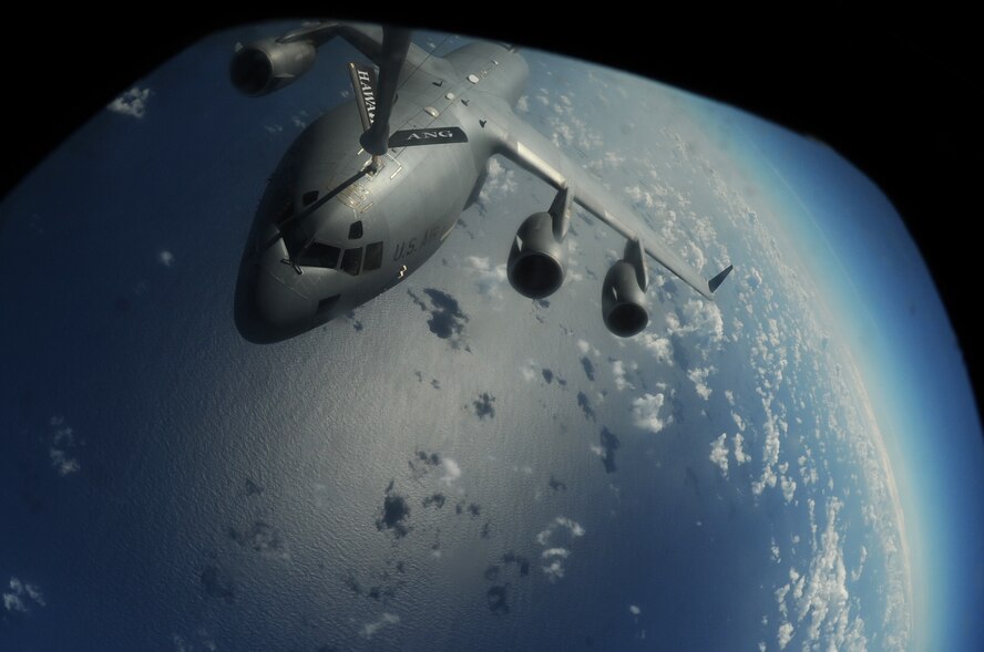 OVER THE PACIFIC -- A C-17 Globemaster III from the 15th Wing, Joint Base Pearl Harbor Hickam, takes on fuel from a Hawaii Air National Guard 204th Air Refueling Squadron KC-135 Stratotanker during a mission to Andersen Air Base, Guam.  The 15th Wing and the Hawaii National Guard?s 154th Wing operate both the C-17 and the KC-135 in a Total Force Integration partnership. They also operate the F-22 Raptor. (U.S. air Force photo/Staff Sgt. Mike Meares)