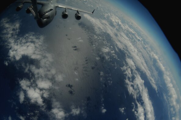 OVER THE PACIFIC -- A C-17 Globemaster III from the 15th Wing, Joint Base Pearl Harbor Hickam, takes on fuel from a Hawaii Air National Guard 204th Air Refueling Squadron KC-135 Stratotanker during a mission to Andersen Air Base, Guam. The 15th Wing and the Hawaii National Guard?s 154th Wing operate both the C-17 and the KC-135 in a Total Force Integration partnership. (U.S. air Force photo/Staff Sgt. Mike Meares) 
