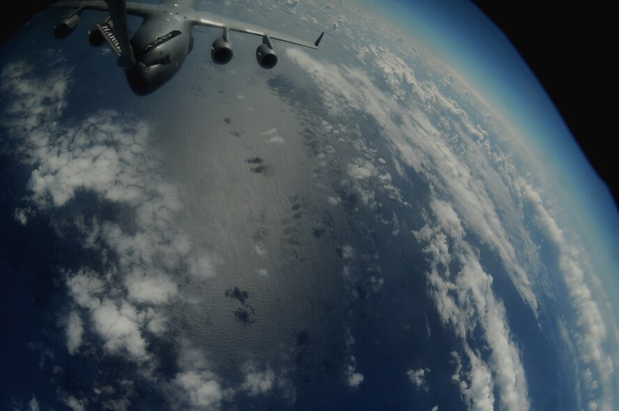 OVER THE PACIFIC -- A C-17 Globemaster III from the 15th Wing, Joint Base Pearl Harbor Hickam, takes on fuel from a Hawaii Air National Guard 204th Air Refueling Squadron KC-135 Stratotanker during a mission to Andersen Air Base, Guam.  The 15th Wing and the Hawaii National Guard?s 154th Wing operate both the C-17 and the KC-135 in a Total Force Integration partnership. They also operate the F-22 Raptor. (U.S. air Force photo/Staff Sgt. Mike Meares)
