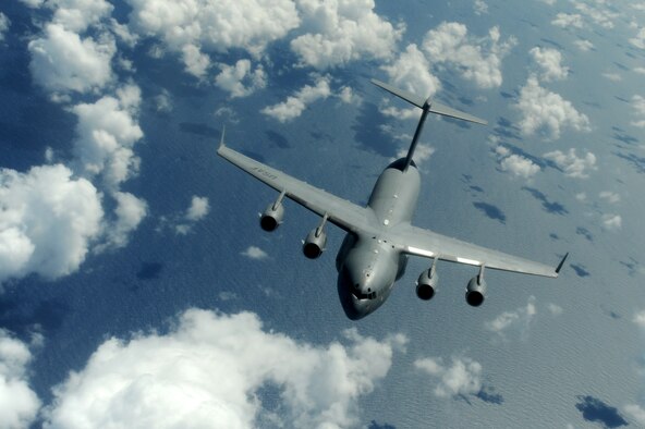 OVER THE PACIFIC -- A C-17 Globemaster III from the 15th Wing, Joint Base Pearl Harbor Hickam, takes on fuel from a Hawaii Air National Guard 204th Air Refueling Squadron KC-135 Stratotanker during a mission to Andersen Air Base, Guam. The 15th Wing and the Hawaii National Guard?s 154th Wing operate both the C-17 and the KC-135 in a Total Force Integration partnership. (U.S. air Force photo/Staff Sgt. Mike Meares) 
