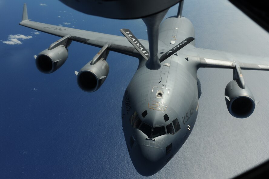 OVER THE PACIFIC -- A C-17 Globemaster III from the 15th Wing, Joint Base Pearl Harbor Hickam, takes on fuel from a Hawaii Air National Guard 204th Air Refueling Squadron KC-135 Stratotanker during a mission to Andersen Air Base, Guam.  The 15th Wing and the Hawaii National Guard?s 154th Wing operate both the C-17 and the KC-135 in a Total Force Integration partnership. They also operate the F-22 Raptor. (U.S. air Force photo/Staff Sgt. Mike Meares)