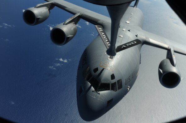 OVER THE PACIFIC -- A C-17 Globemaster III from the 15th Wing, Joint Base Pearl Harbor Hickam, takes on fuel from a Hawaii Air National Guard 204th Air Refueling Squadron KC-135 Stratotanker during a mission to Andersen Air Base, Guam. The 15th Wing and the Hawaii National Guard?s 154th Wing operate both the C-17 and the KC-135 in a Total Force Integration partnership. (U.S. air Force photo/Staff Sgt. Mike Meares) 
